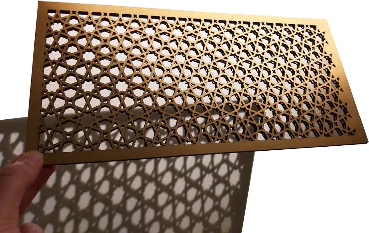 Photograph of a CNC-milled plywood table with matching stools in a concrete space