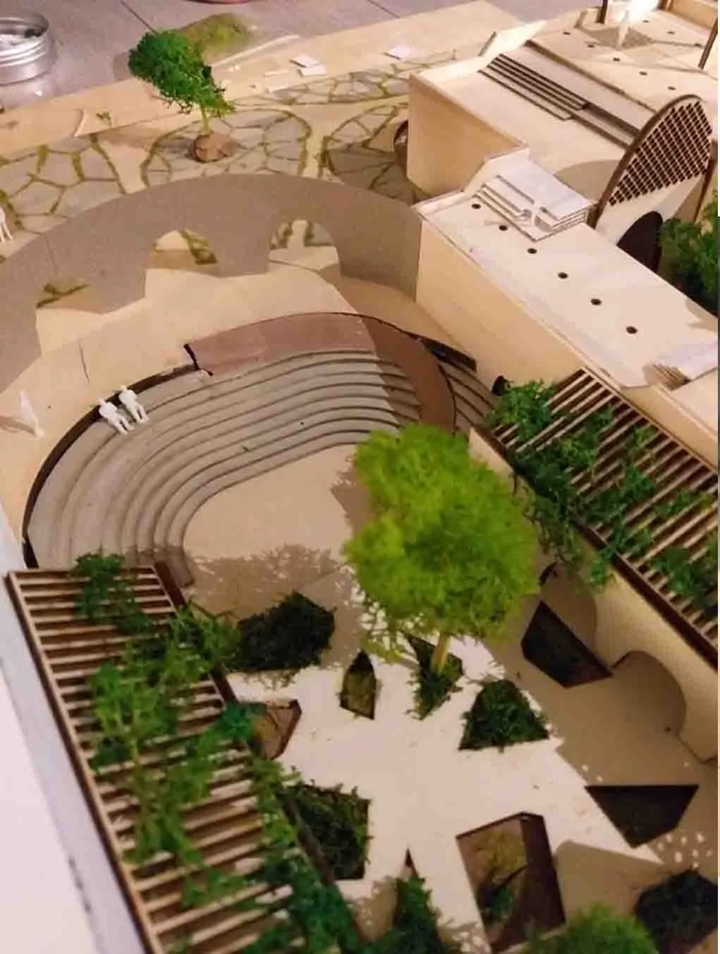 Close photograph of the model showing a stepped amphitheatre surrounded by planting and vaulted buildings